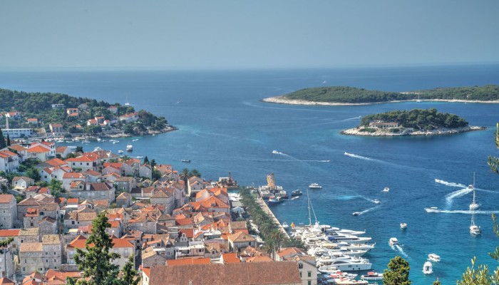 Birds eye view of terracotta roofs along the sea in Montenegro